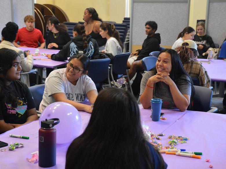 Penn State Abington (near Philadelphia) students at sister2sister event sitting at tables